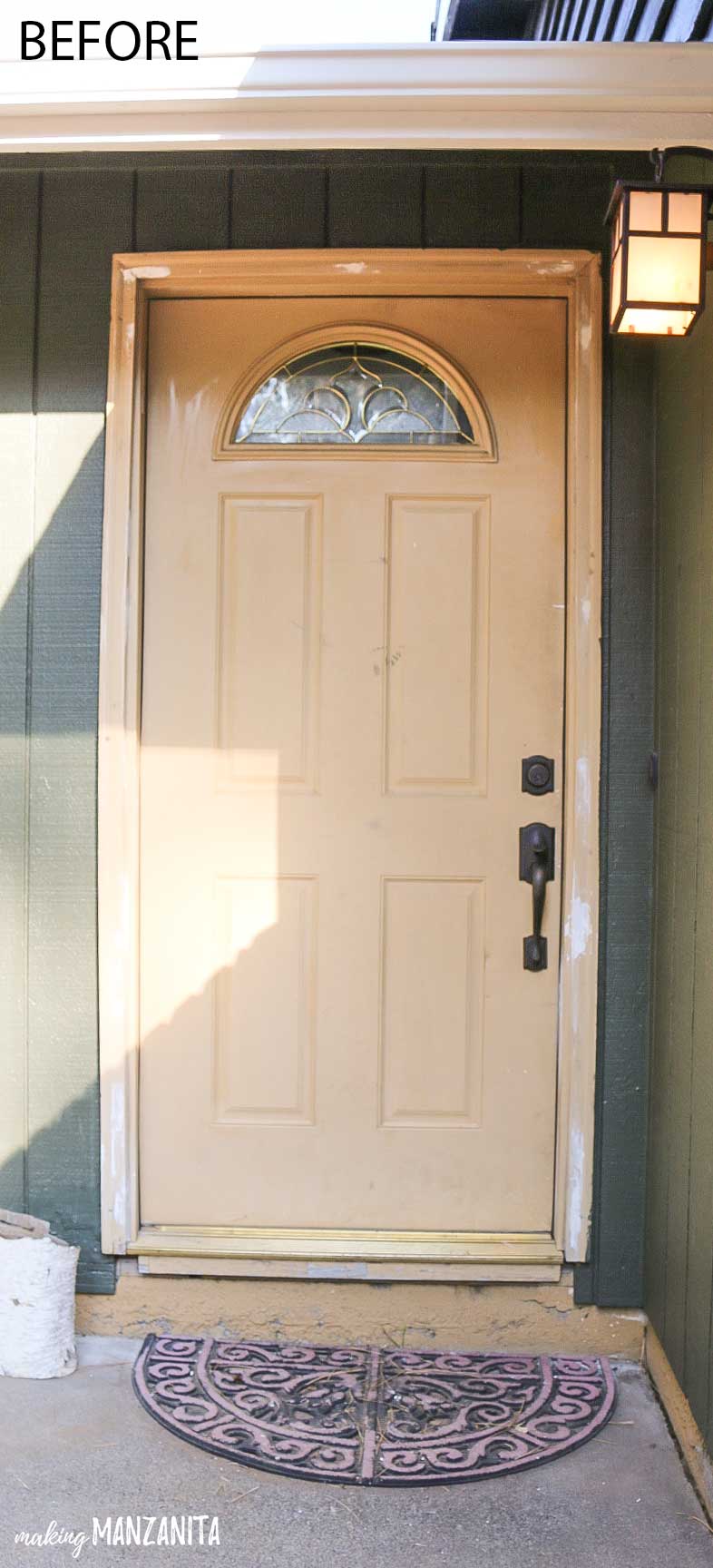 A picture of our front door before we repainted. Our front door was an ugly tan color. 