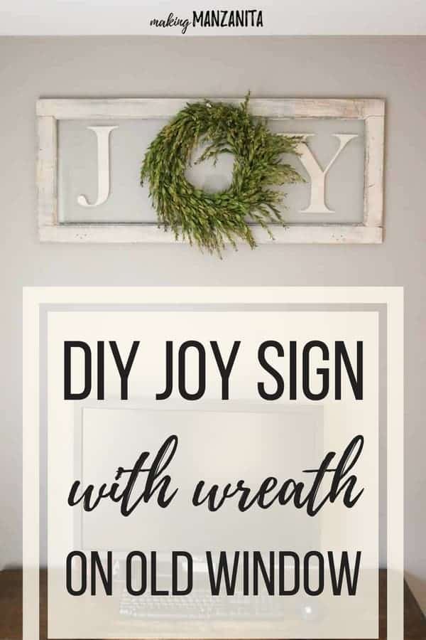 A reclaimed vintage window is the perfect base for this farmhouse style Joy Christmas sign with a wreath.