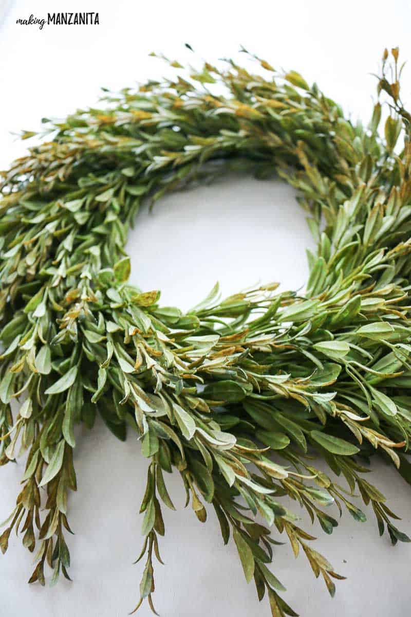 A full and whispy farmhouse wreath made with faux green tea leaves