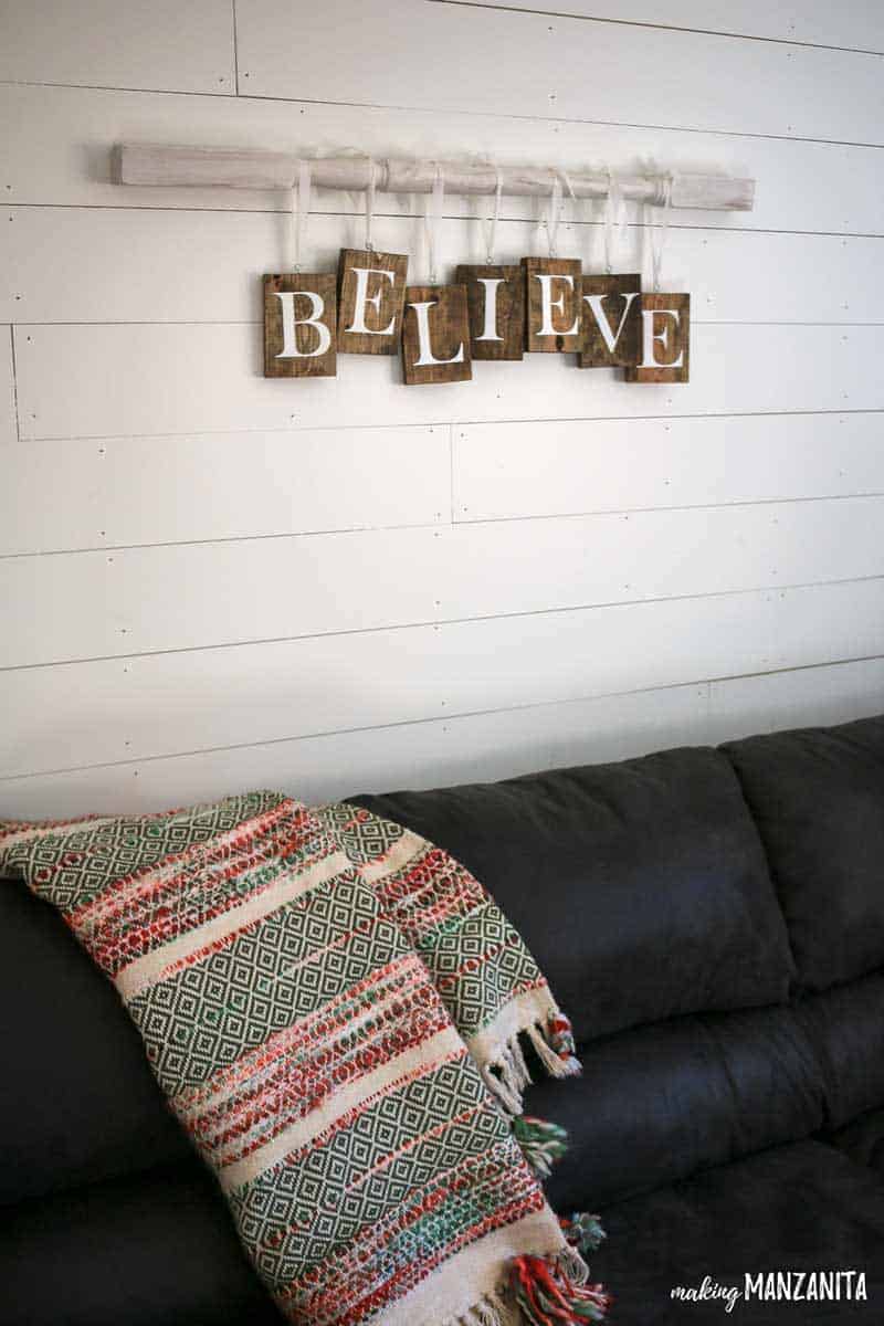 I love how the wooden blocks are staggered on this easy and fun DIY Farmhouse style Christmas sign