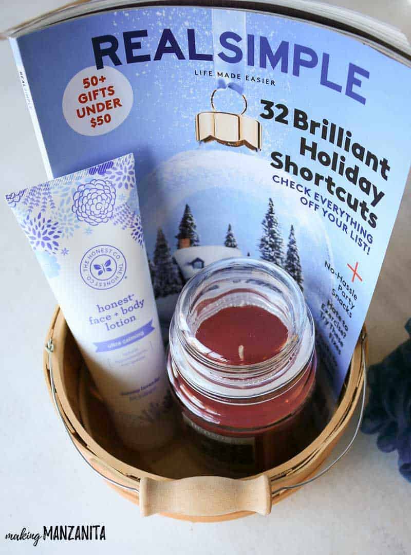 Magazine, candle and lotion inside wooden bucket for relaxation basket ideas