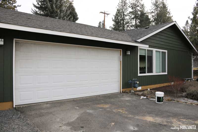 Before painting the garage door, it was dirty and grimy from years of caked on dirt.