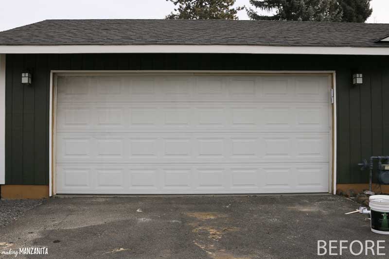 Before painting the garage door: a dirty, old white garage door soiled with years of grime.