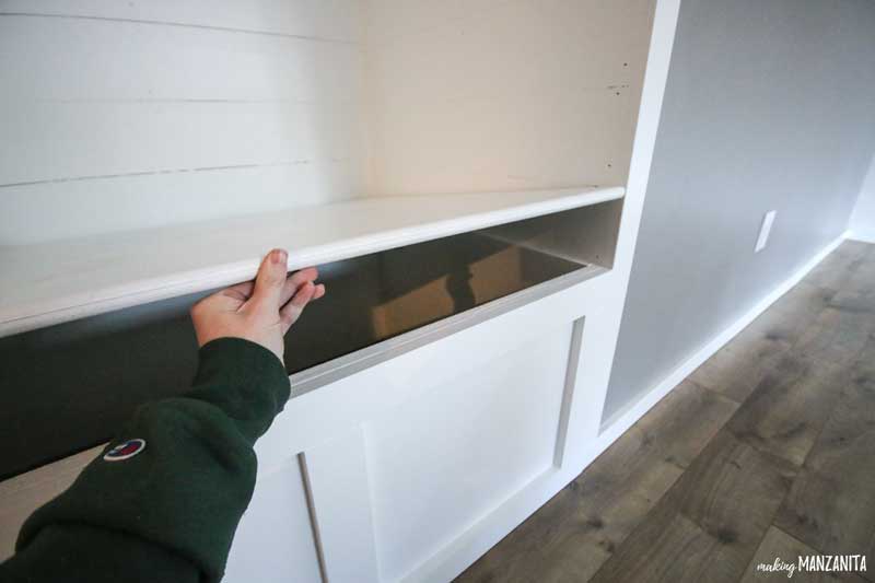 Our living room reading nook as a convenient storage bench with a lid that lefts up for extra storage.