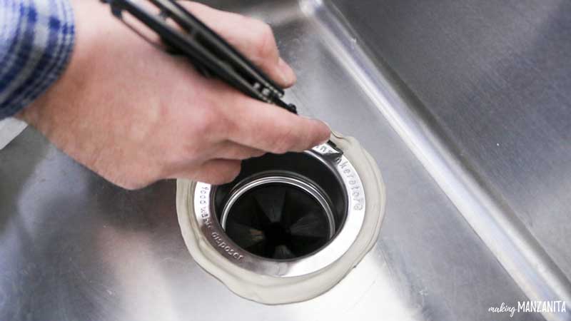 Removing excess plumber's putty when installing sink drain and garbage disposal