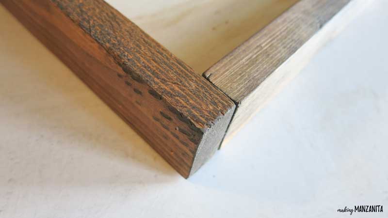 Two pieces of wood furring strips came together at the corners for the frame of the shiplap sign with small finish nails