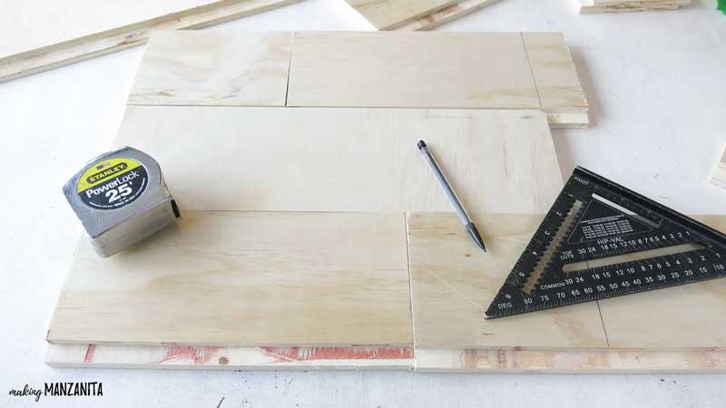You'll need a measuring tape, pencil, and square measuring tool to arrange the DIY shiplap sign before cutting the wood down to size