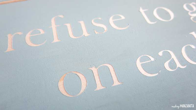 Here's a closer look at the peeled words off the shiplap sign from the stencil after painting over