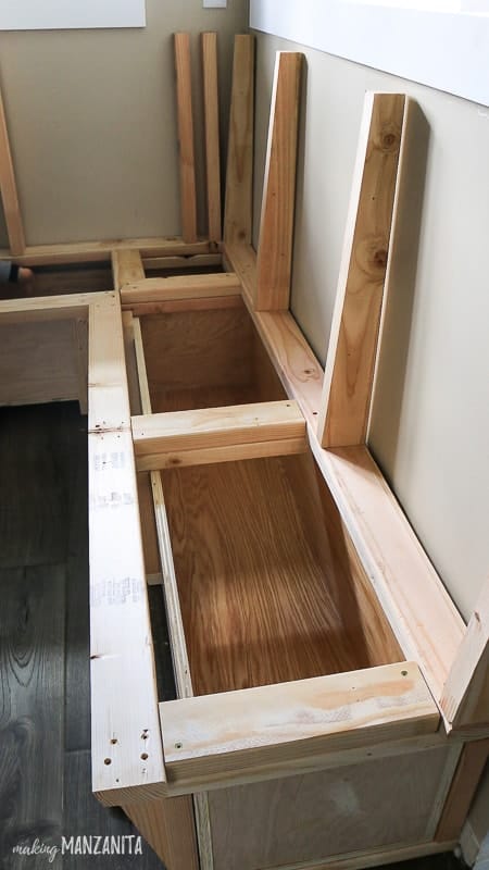 Interior framing and plywood storage boxes for banquette corner bench seating