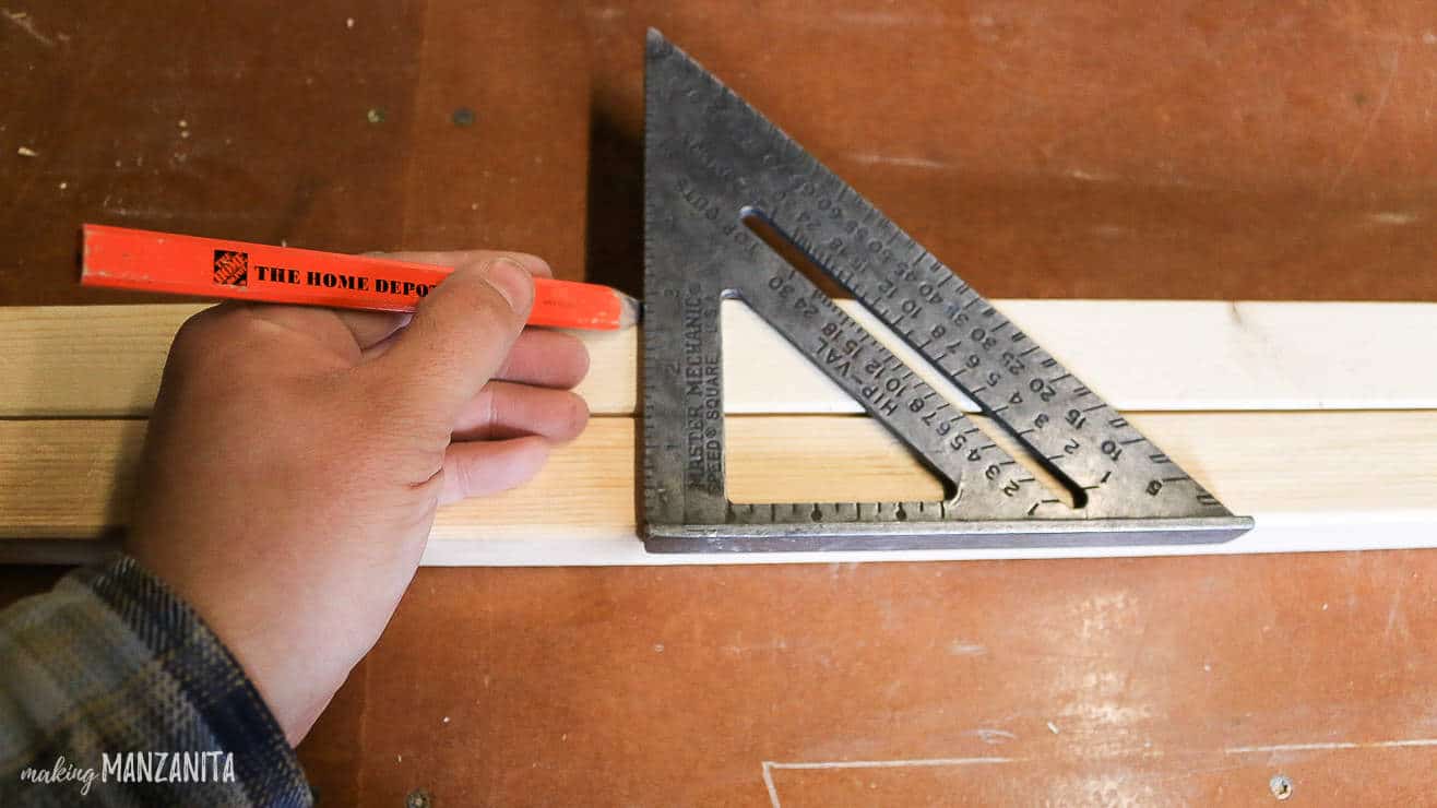 Using a triangle ruler and pencil to mark where to install spacers.