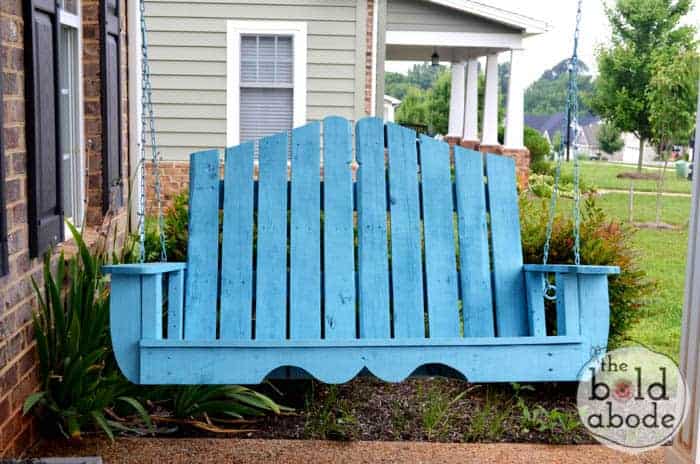 Pallet wood made into a swinging bench and painted blue