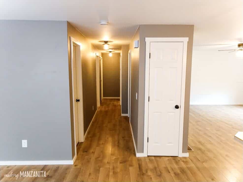 The view looking down the renovated hallway from our living room -- room has updated flooring, painted walls, and new lighting.
