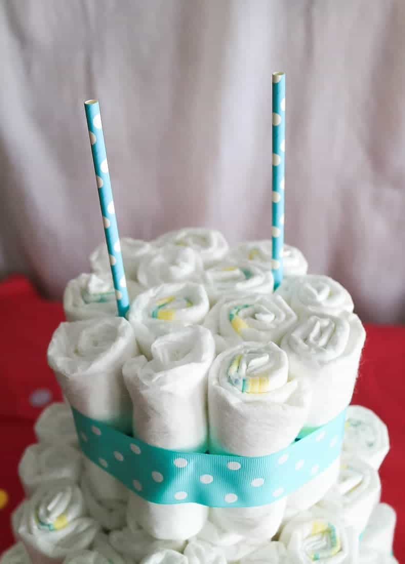 Decorative straws in the top of the diaper cake to make a topper 