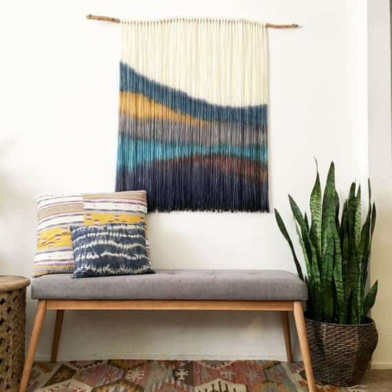 This dip dyed wall hanging is a great way to decorate above your bed in your boho style bedroom