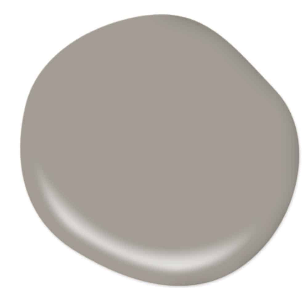 A paint-drop sample of Fashion Gray - a deep brownish-gray paint color