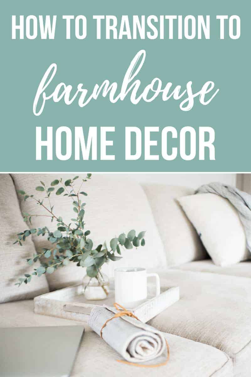 How to transition to farmhouse style home decor - a white couch with a white wood serving tray, white vase with eucalyptus leaves and rolled linen napkins. 