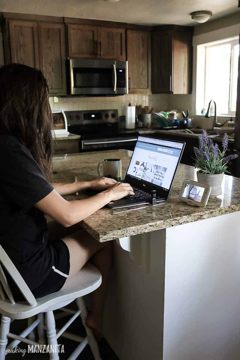 This new mom juggles working while watching the baby with a must-have video baby monitor.