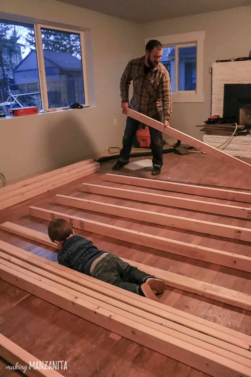 Interior wall framing getting laid out on the floor before being raised and attached