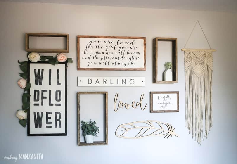 We included a fun rustic boho style gallery wall in our baby girl nursery, complete with a macramé wall hanging and fun wall art pieces.