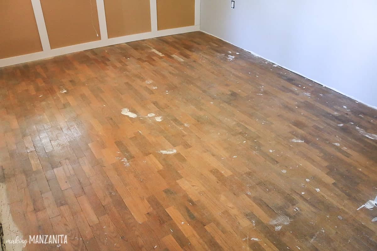 The old, original hardwood floors in our spare room that need to be refinished.