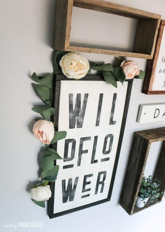 Rustic wildflower sign for baby girl nursery decor with a peony garland swag