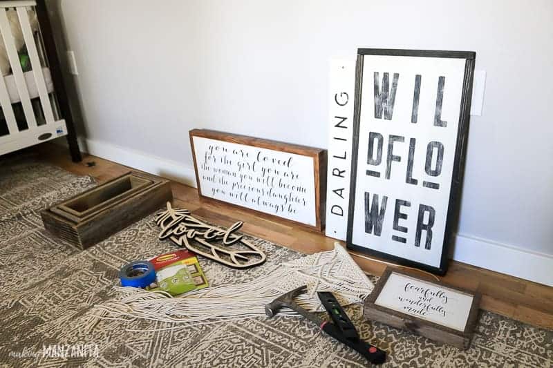 Planning a gallery wall layout requires gallery wall supplies like pictures and decorations