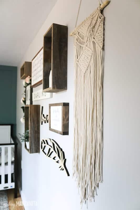 Boho inspired gallery wall with hanging tapestry and picture frames