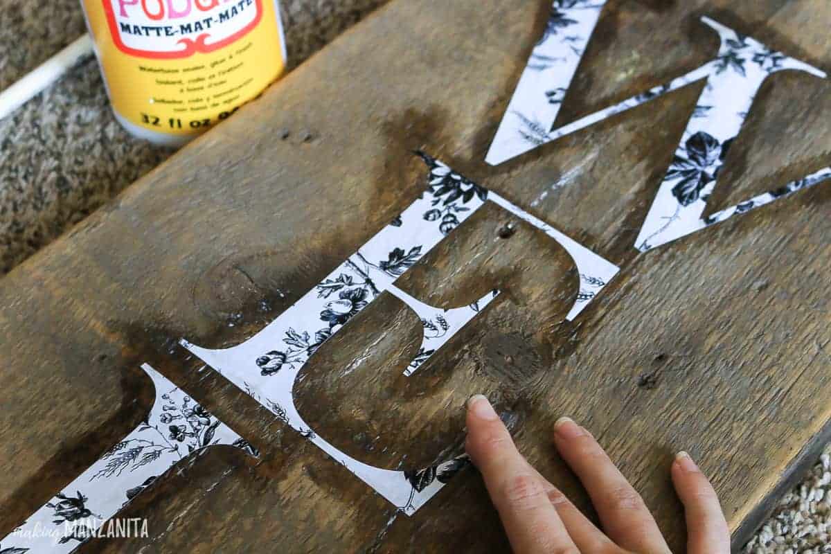 Sealing stencils with Mod Podge for crisp paint lines on wooden signs