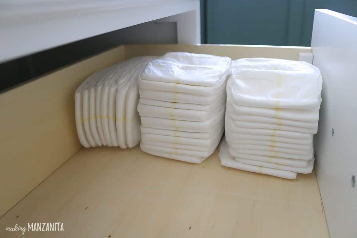 Neatly stacked diapers is a key item to keep in your organized changing table drawers