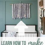 Yarn wall hanging above crib with text overlay that says learn how to make this yarn hanging