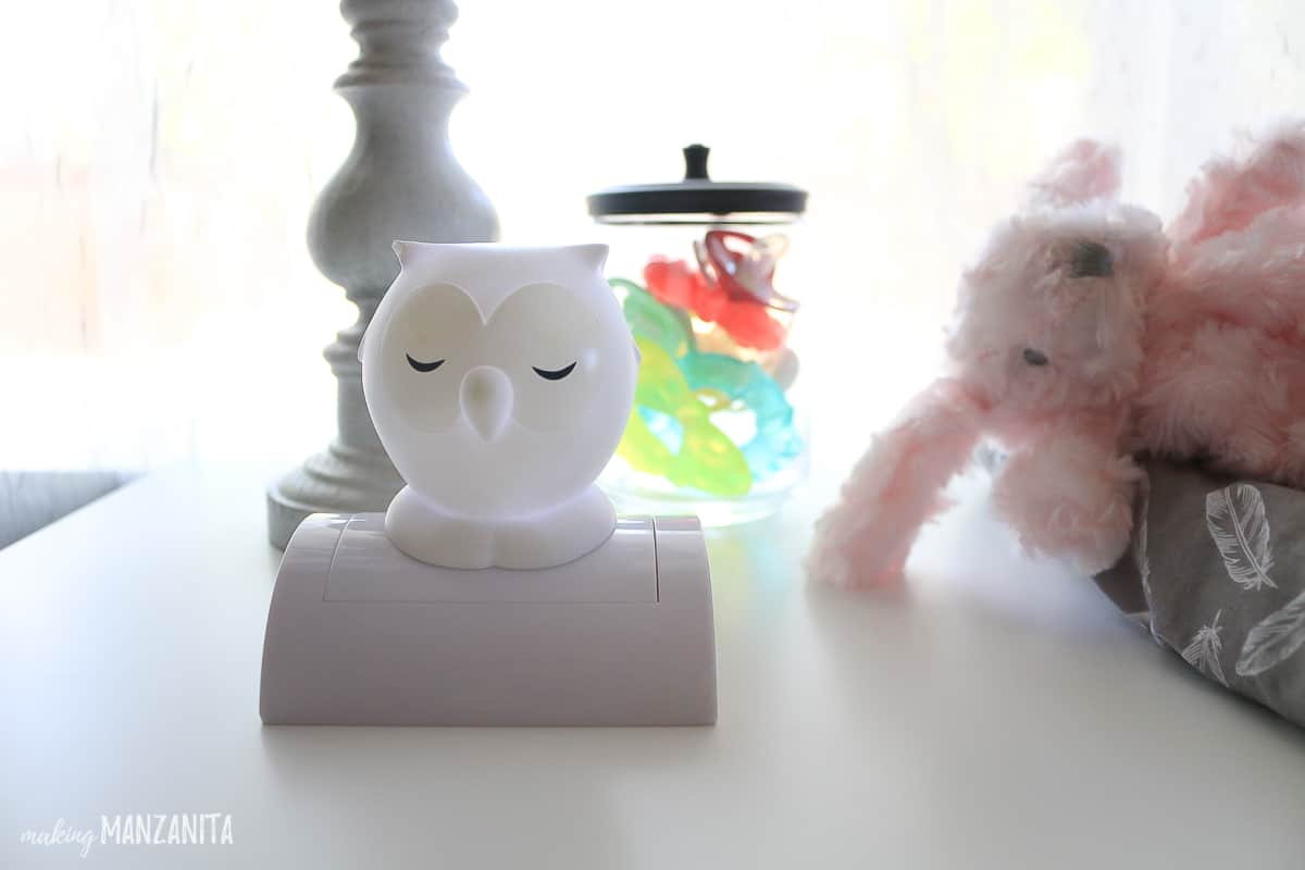 A push-on nightlight sits atop a changing table, perfect for late-night diaper changes and feedings