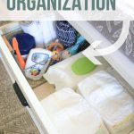 drawers with diaper changing supplies organized with text overlay that says changing table organization