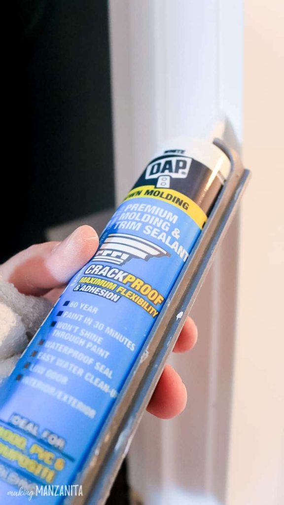 DAP Alex Flex caulking being applied to door frame and trim