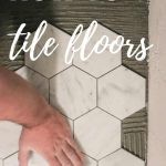 Man pressing marble tiles down on flooring with text overlay that says how to tile floors