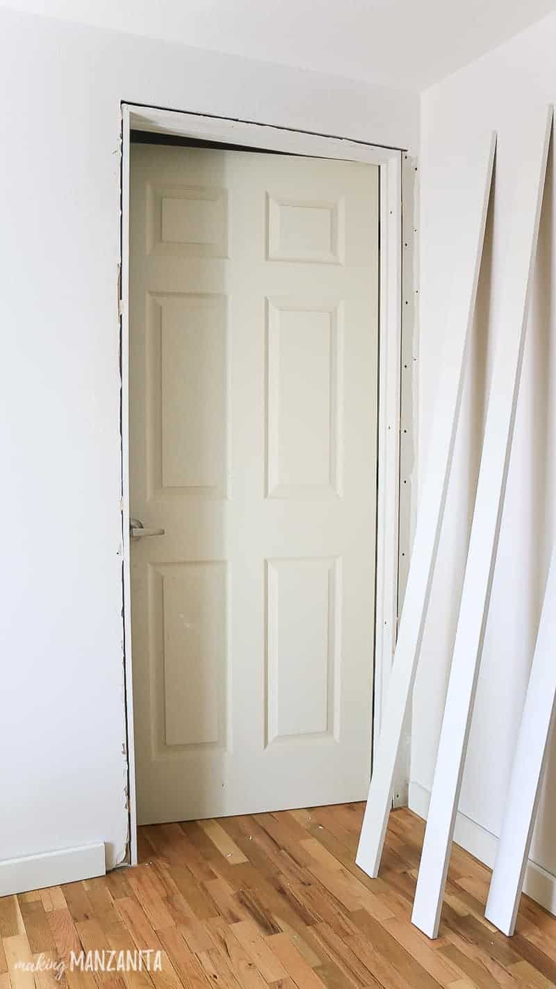 Interior door installed but missing trim in a tutorial for how to install a prehung door