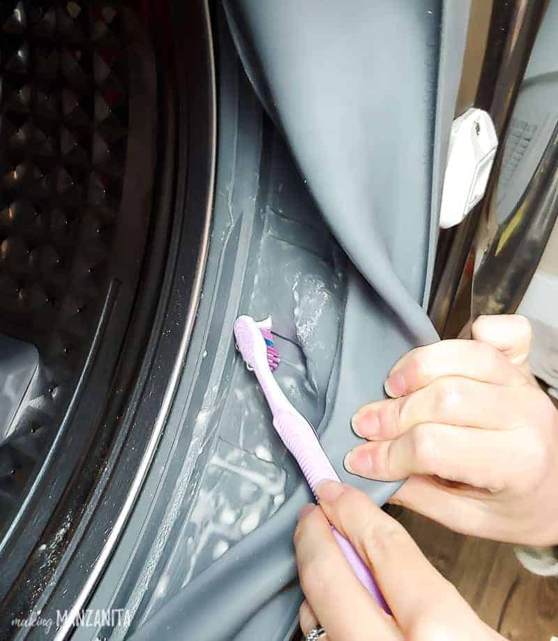 Use a toothbrush and baking soda solution to clean the inside of the rubber gasket of the front loading washer