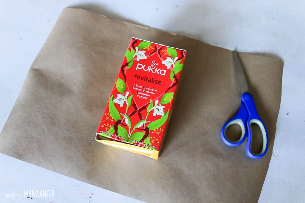 Wrapping a gift of tea in brown paper.