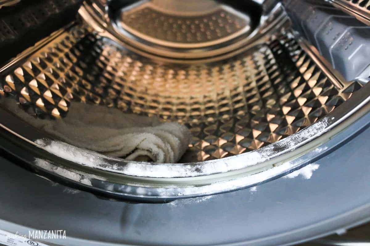 The easiest way to clean the rubber gasket of your washing machine is with baking soda and a toothbrush to get all the gunk and dirt out.