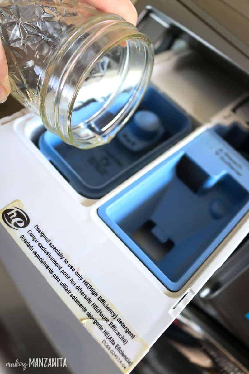 Pour baking soda and the vinegar and water solution into the detergent drawer of your washing machine before running the cleaning cycle.