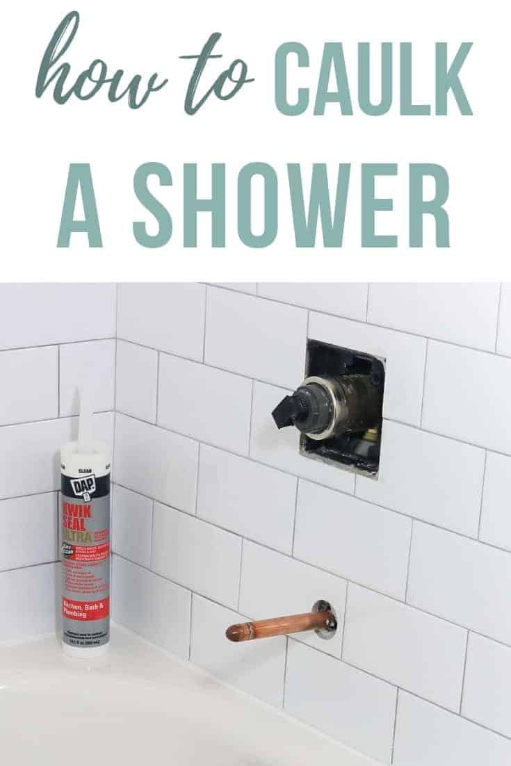Bottle of shower caulk sitting on the corner of bathtub with white subway tile in the background and text overlay that says how to caulk a shower