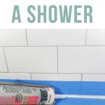 Caulk getting applied in the joint where the bath tub meets the shower wall with text overlay that says how to caulk a shower