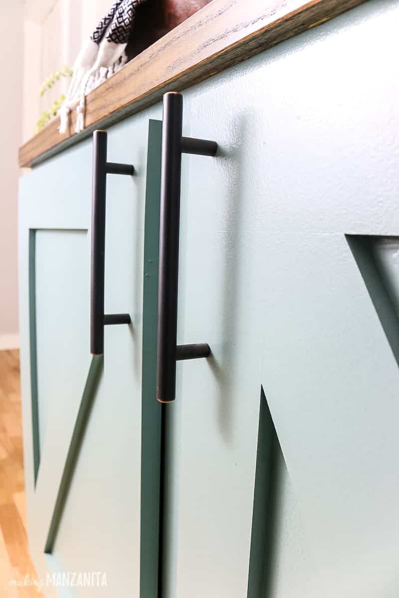 A close up look at the modern industrial cabinet handles we installed on our new hallway cabinet.