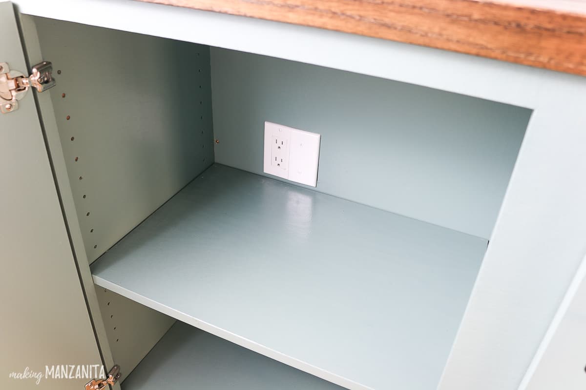 Our new hallway cabinet includes an electrical outlet tucked in the back for convenience.