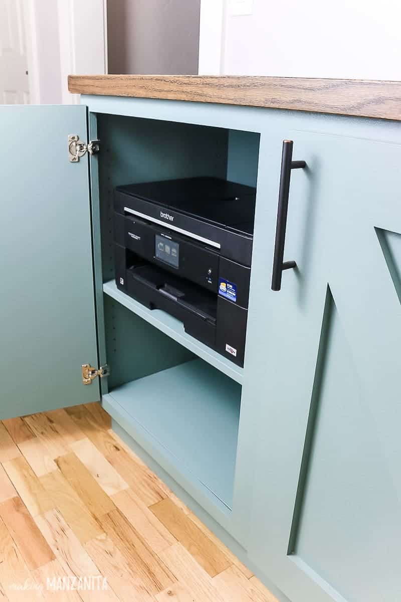 Our new hallway cabinet is the perfect storage spot for our printer, which tucks neatly into the cabinet.