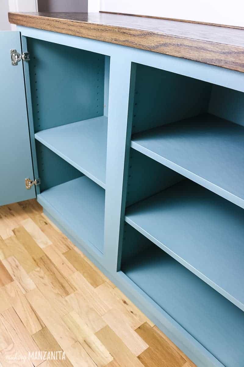 A look at the inside of our new hallway cabinet, with soft-closing doors and adjustable shelves.