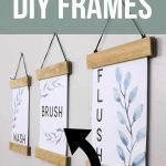 Three DIY frames hanging on a gray wall holding printable art that says wash brush and flush for bathroom art with text overlay that says super cheap & easy DIY Frames and bathroom printables