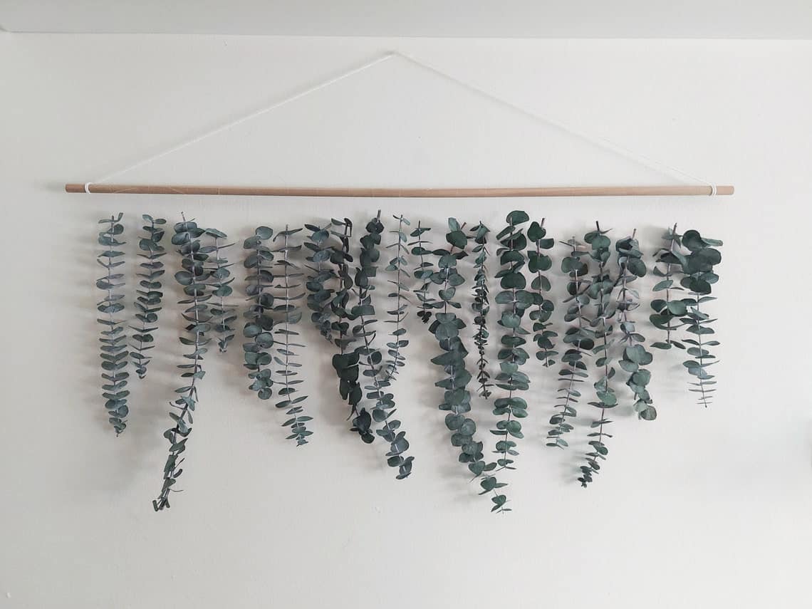 Not only is eucalyptus a beautiful greenery, but if you go with a real eucalyptus hanging, you'll benefit from the aromatic scent that can help promote a healthy immune system.