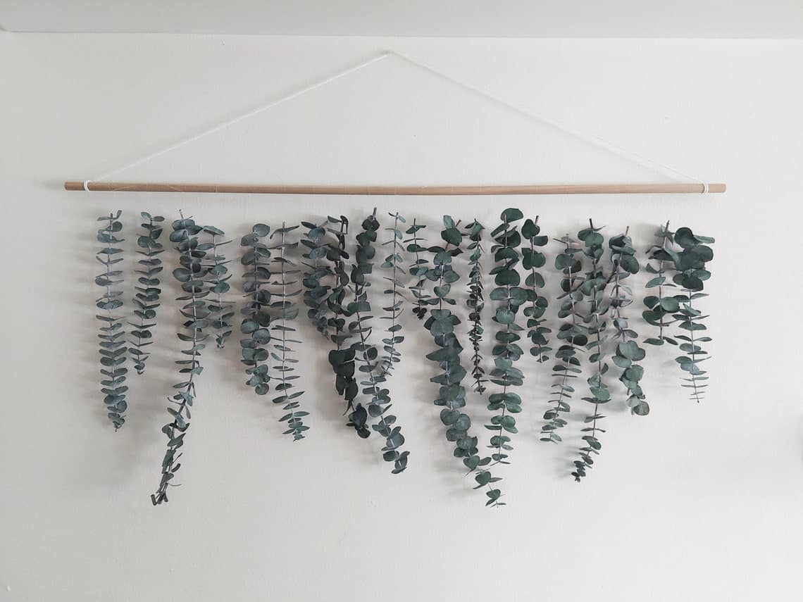 Not only is eucalyptus a beautiful greenery, but if you go with a real eucalyptus hanging, you'll benefit from the aromatic scent that can help promote a healthy immune system. 