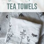 Stack of patterned flour sack cloth towels laying with stamped designs of flowers, butterflies and leaves with text overlay that says DIY stamped tea towels