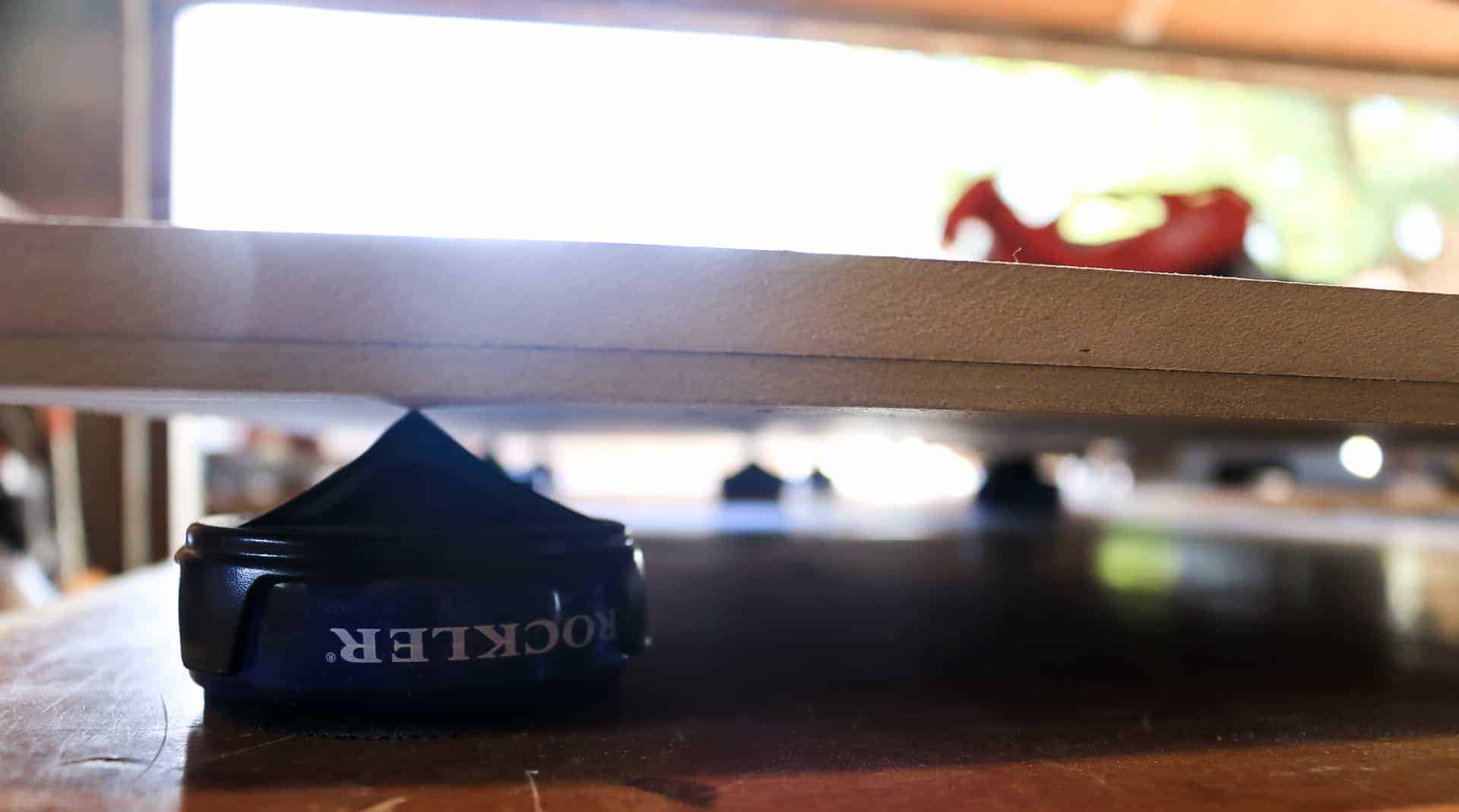 Rockler's little bench cookies hold up the hallway cabinet shelves, making it super easy to paint them without hassle. 